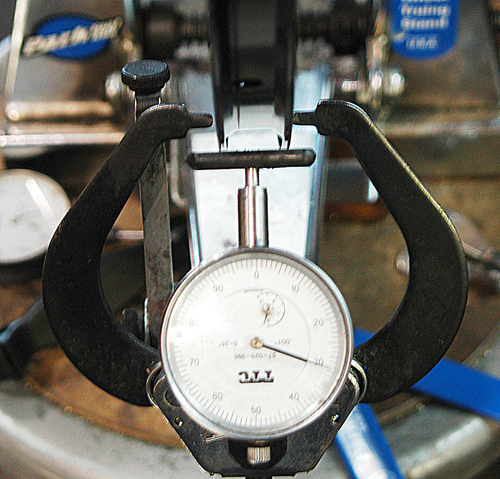 Wheel truing stand with dial indicator